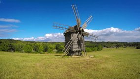Ukraine. Ancient wooden windmill in a meadow. FullHD 1080p video