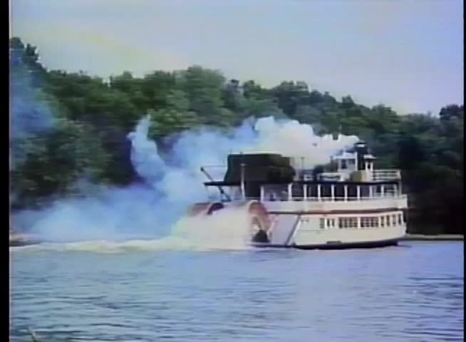 Steam boat traveling down river