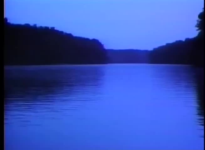 Wide shot of river at dusk