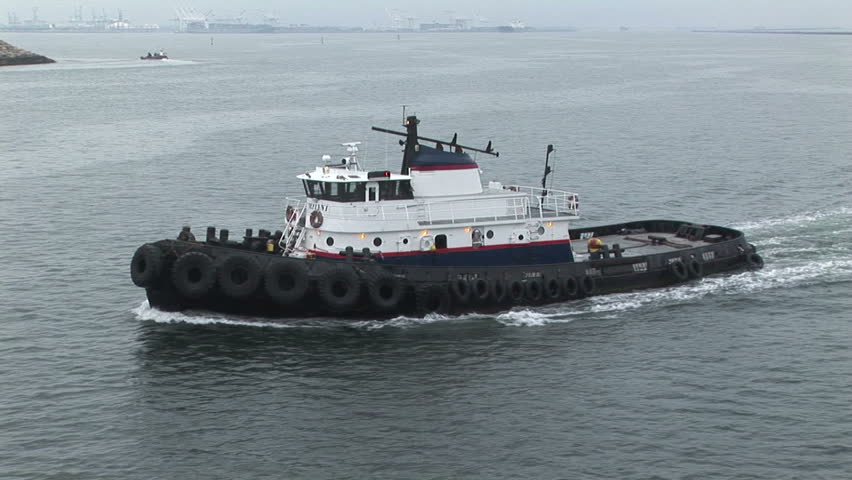 Harbor US tug boat roaming in the Port of Los Angeles, California
