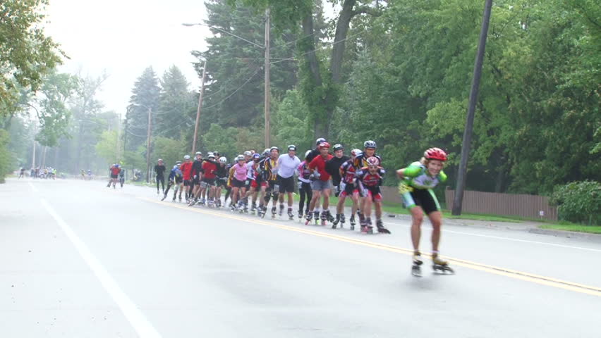 DULUTH, MINNESOTA - CIRCA 2012: Large group of inline skaters racing and passing