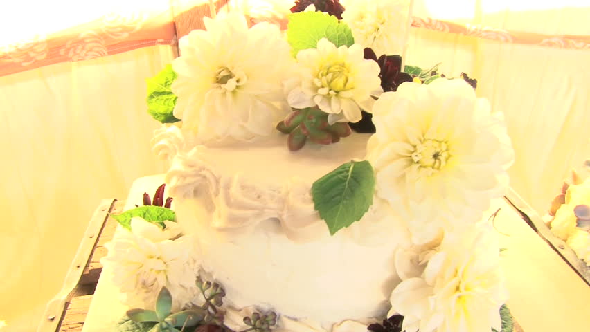 Wedding cake with floral arrangement.