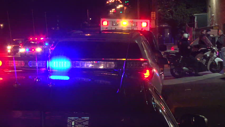PORTLAND, OREGON DOWNTOWN - CIRCA 2012: Police lights flashing at night downtown