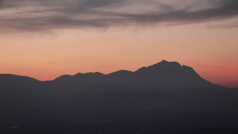 Time lapse of sunset or sunrise on gorgeous Gran Sasso mountain in Italy, called La Bella addormentata, Sleeping Beauty mountains, Abruzzo.