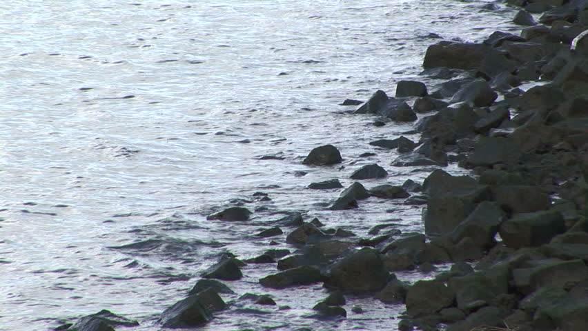 Rocky shoreline along waterway