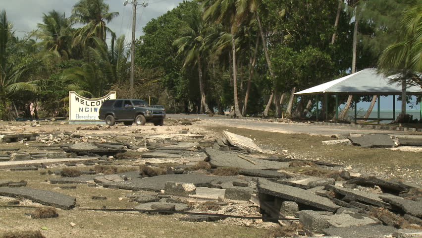 KOROR, PALAU - DECEMBER 2012: Torn up asphalt damaged by hurricane storm surge