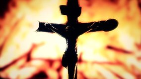 Waving nightmare: a statue of Jesus Christ on the cross (silhouette shadow) over a scary fire. Religious Christian symbolic video.

