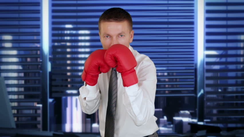 Businessman Boxing with City Skyline on the background