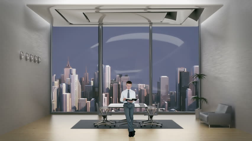 Young Businessman Reading in Office Room with City Skyline in the Background