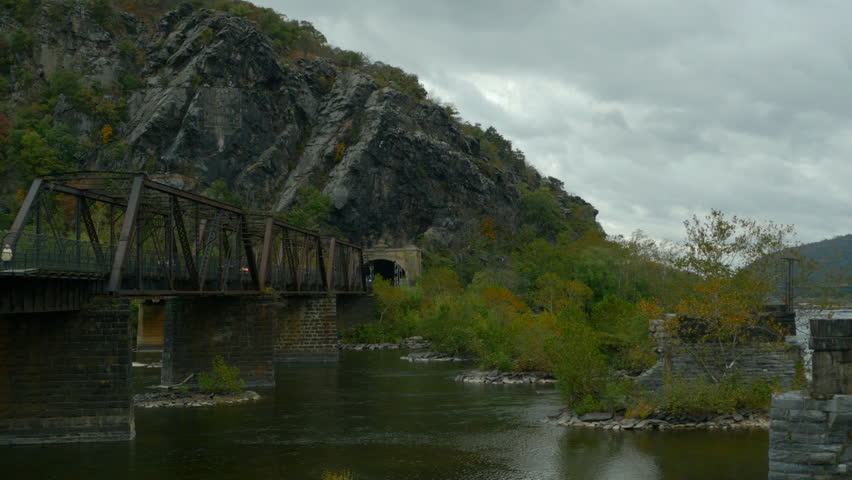 View at old railway bridge and Potomac river at Historical Park of Harpers Ferry WV USA