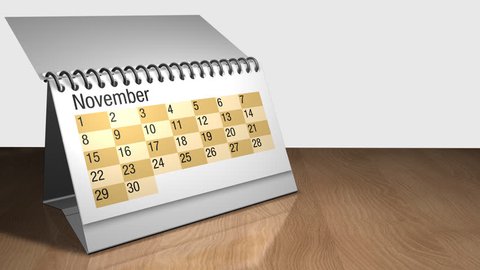 3D animation of a desk calendar on a wooden table with white background. Each sheet contains a month and they are rotating one on top of the other. The calendar contains the date February 29