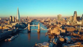 Aerial cityscape flythrough video of London and the River Thames with a view of London Tower Bridge and the Shard