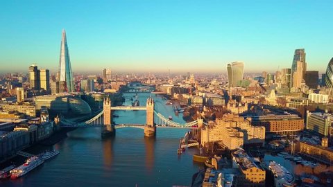 Aerial cityscape flythrough video of London and the River Thames with a view of London Tower Bridge and the Shard