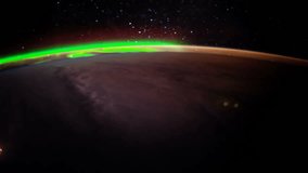 Earth and Aurora Borealis from ISS. Elements of this video furnished by NASA