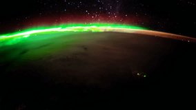 Earth and Aurora Borealis from ISS. Elements of this video furnished by NASA.