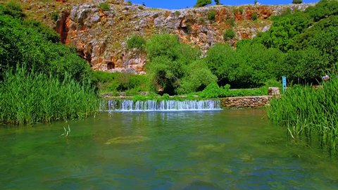 Hermon spring by Banias (Panias) caves in Israel, a popular tourist destination with famous archeological sites