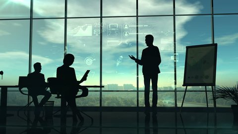 The video shows the silhouettes of the speaker holding the corporate presentation and listeners.The action takes place in the office with huge glass windows in which the sun shines.