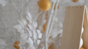 New Year decor in white colors. Balls like oranges on snow-white trees. The video is suitable for the background.