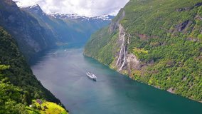 Time lapse clip. Sunny summer scene of Sunnylvsfjorden fjord, Geiranger village location, western Norway. Aerial view of famous Seven Sisters waterfalls. Full HD video (High Definition).