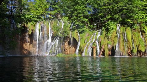 Picturesque morning view of Plitvice National Park. Colorful spring scene of green forest with pure water waterfall. Great countryside landscape of Croatia, Europe. Full HD video (High Definition).
