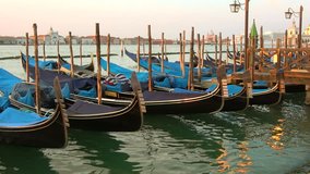Moored gondolas on the background of the canale della Giudecca in the early morning. Venice