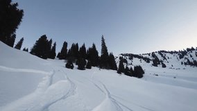 Extreme snowboarder woman riding by powder at mountain, backcountry. 4k video about Snowboarding, winter activities and lifestyle footage