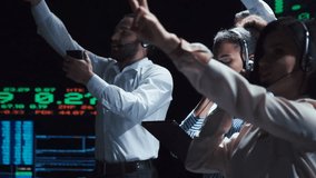 Professional financial traders working in modern office conducting trades and analyzing currency growth. - Powered by Shutterstock - Get 15% off with code: PIKWIZARD15