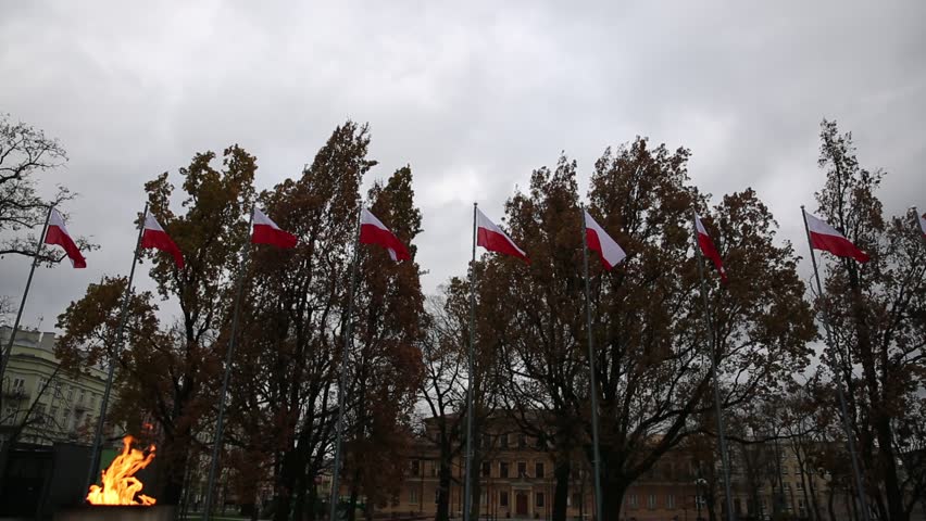 Flags on masts and lit candles.
