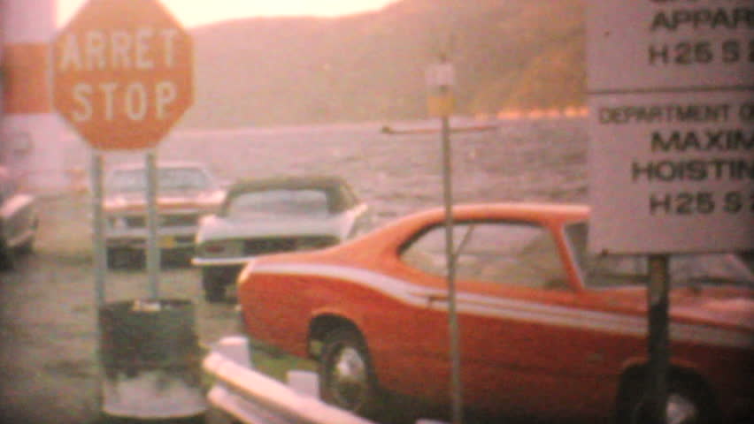 Cars wait to board a ferry to various islands in northern Canada en route to do some hunting in 1969.