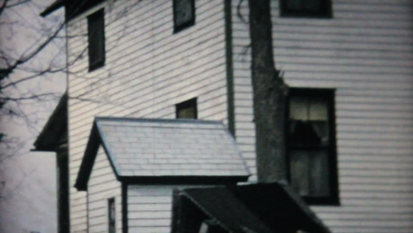 An old hunting cabin stands peacefully near a beautiful river in the country in 1968.