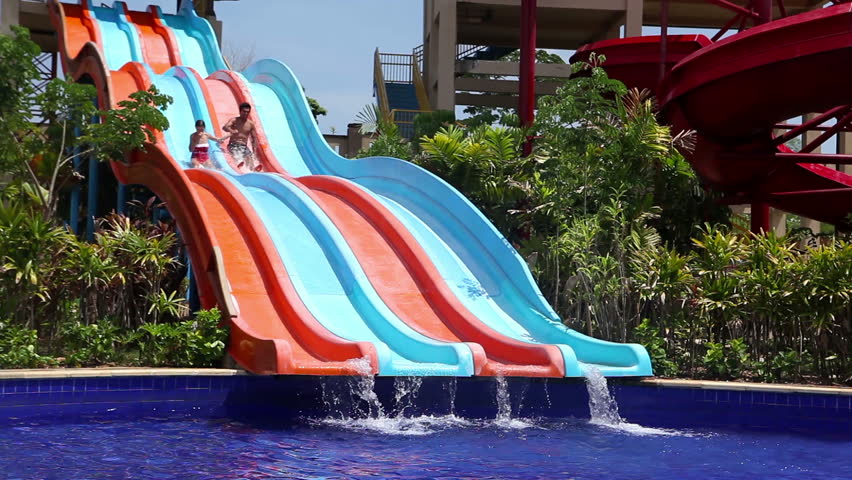 boy and girl on water slides