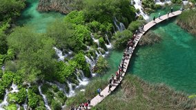 Aerial morning view of Plitvice National Park. Colorful spring scene of green forest with pure water waterfall. Great countryside landscape of Croatia, Europe. Full HD video (High Definition).