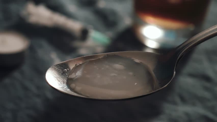 cooking cocaine on a spoon