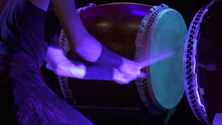 A anonymous taiko drummer performing on stage