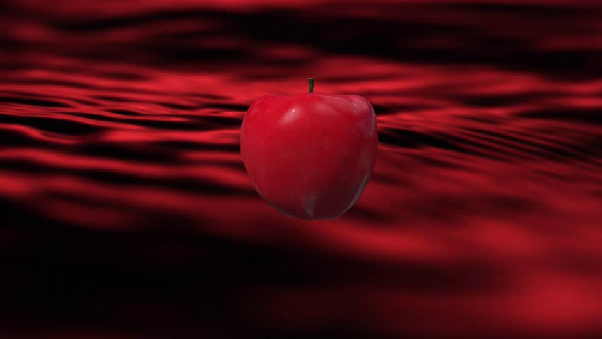 slow motion apple into water