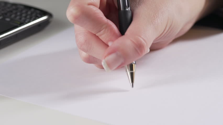 Businesswoman hand writes best wishes on a blank paper. 