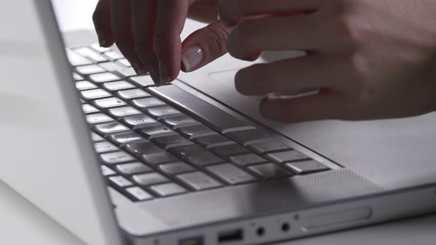 Close-Up Of Female Hand Typing On The Laptop