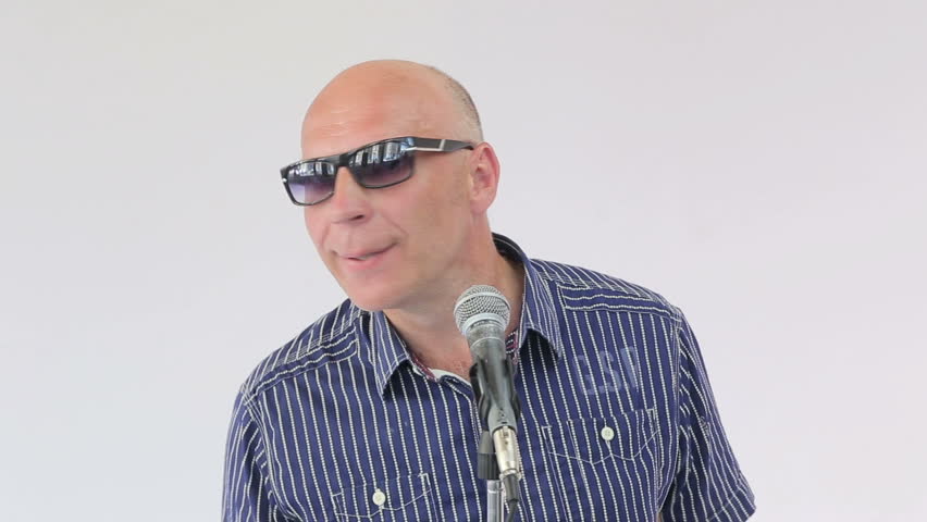 Man sings a song, close up portrait of clip shooting isolated on white