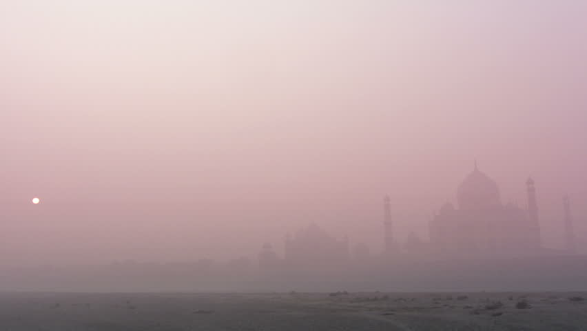 Taj Mahal at sunrise in fog - timelapse
