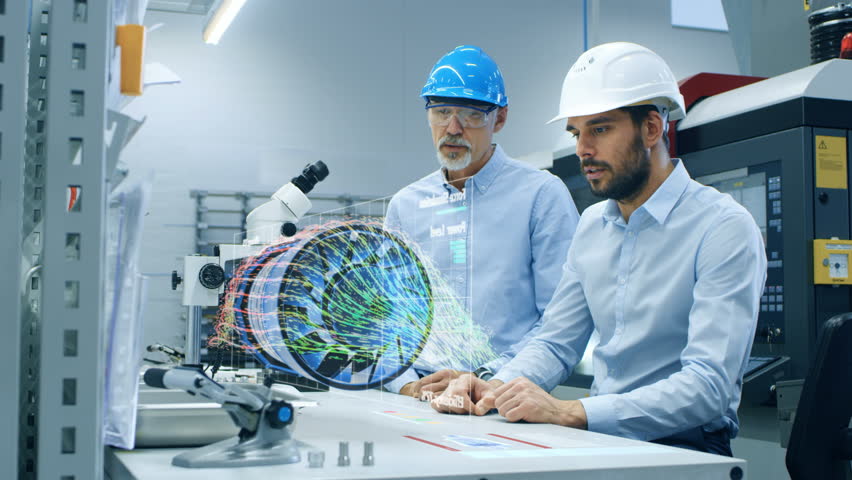 In High Tech Futuristic Factory Two Engineers Works with Holographic Projection 3D Model of the Engine Turbine Prototype. Futuristic Desing of Virtual Mixed Reality Application.