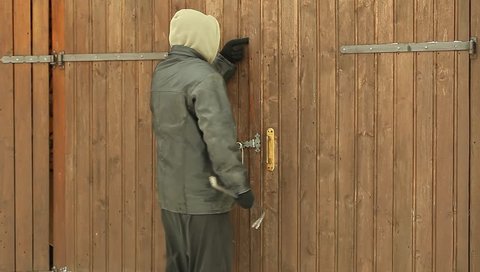 Robber near the garage door
