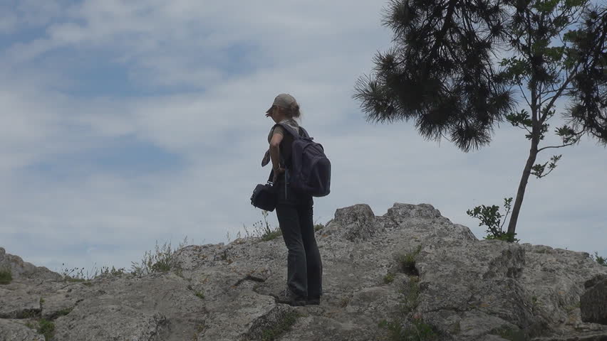 Blonde girl looking around her village