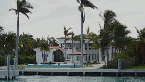 luxurious villa in white colours and own dock for yachts or boats on the shore,sunny isles beach,miami