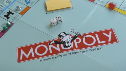 BOSTON, MA - NOV 14: Playing Monopoly board game on November 14, 2017. The Monopoly game is currently published in 47 languages and sold in 114 countries.