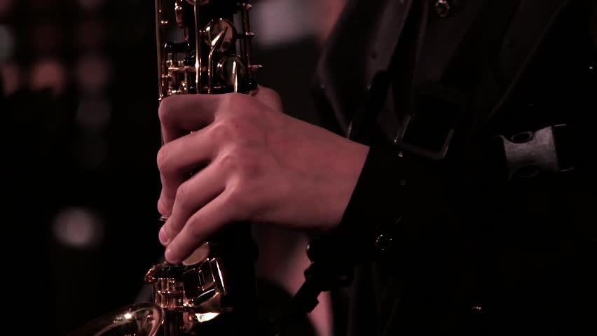 Close-up. A man's hand in a black suit on a saxophone. Footage on a musical theme. Royalty-Free Stock Footage #32729902