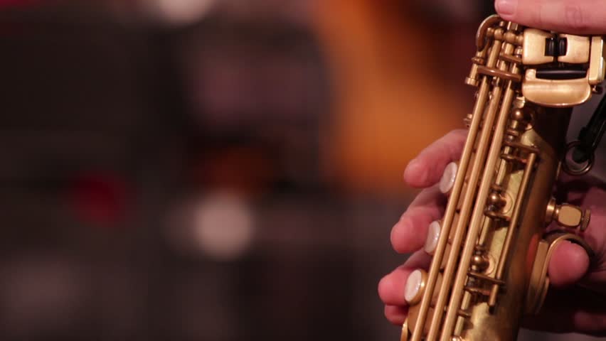 Close-up part of a woodwind instrument soprano saxophone while playing music. Royalty-Free Stock Footage #32729905