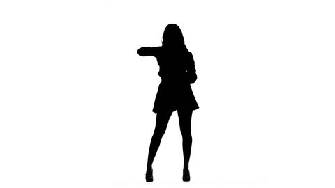 Girl is dancing a sexy dance. Silhouette. White background