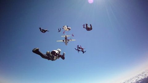 Skydiving big group getting together in free fall, adventure concept