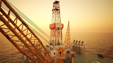 Drone Fly-through shot of oil rig on the open sea, during sunset.