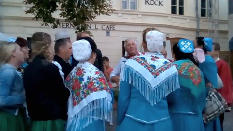 ROMANIA SIGHISOARA - AUGUST 18 2016: Ethnic minorities festival is being held on a yearly basis. Russian ethnics group singing and dancing folk music and dances